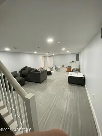 a living room with furniture a table and a flat screen tv
