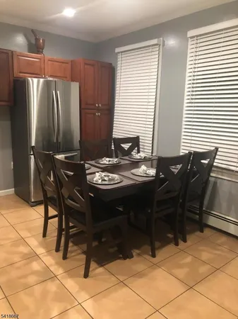 a view of a dining room with furniture and window