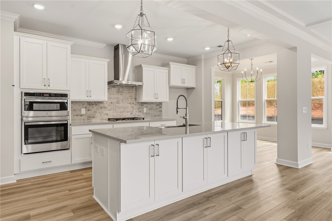 405 Botany Lane Anderson, SC 29621 - Photo 8 of 30 Bright and open, this kitchen features a central island perfect for gathering.