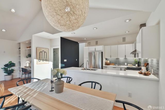 a view of a dining room with furniture window and outside view