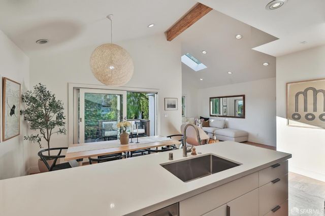 a living room with furniture a rug and a wooden floor