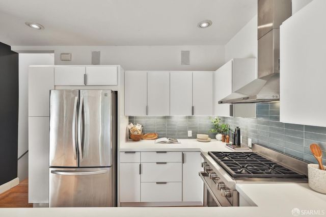 a living room with furniture and flowers