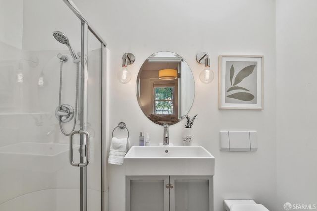 a balcony with wooden floor and outdoor seating