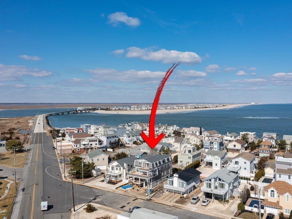 335 7th Street Avalon, NJ 08202 - Photo 3 of 3 a view of a balcony with dining table and chairs