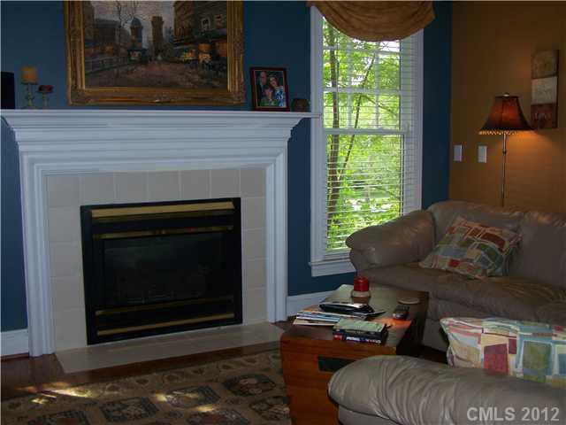 112 Morrison Hill Road Davidson, NC 28036 - Photo 7 of 13 a living room with furniture and a fireplace