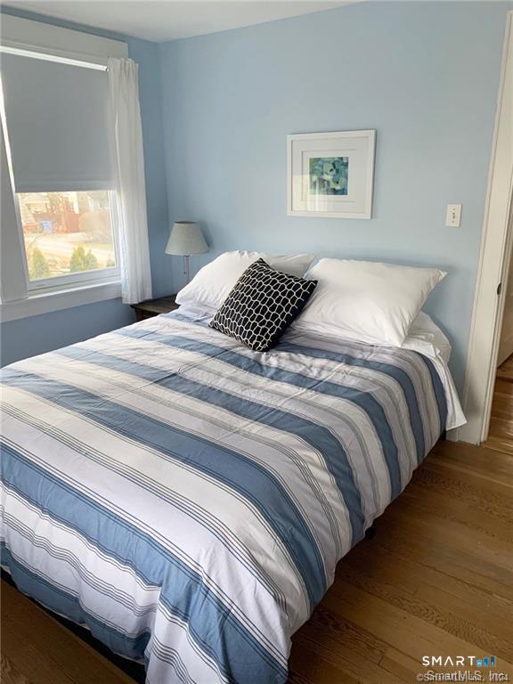 12 Flower Avenue Madison, CT 06443 - Photo 12 of 24 a bedroom with a bed and window