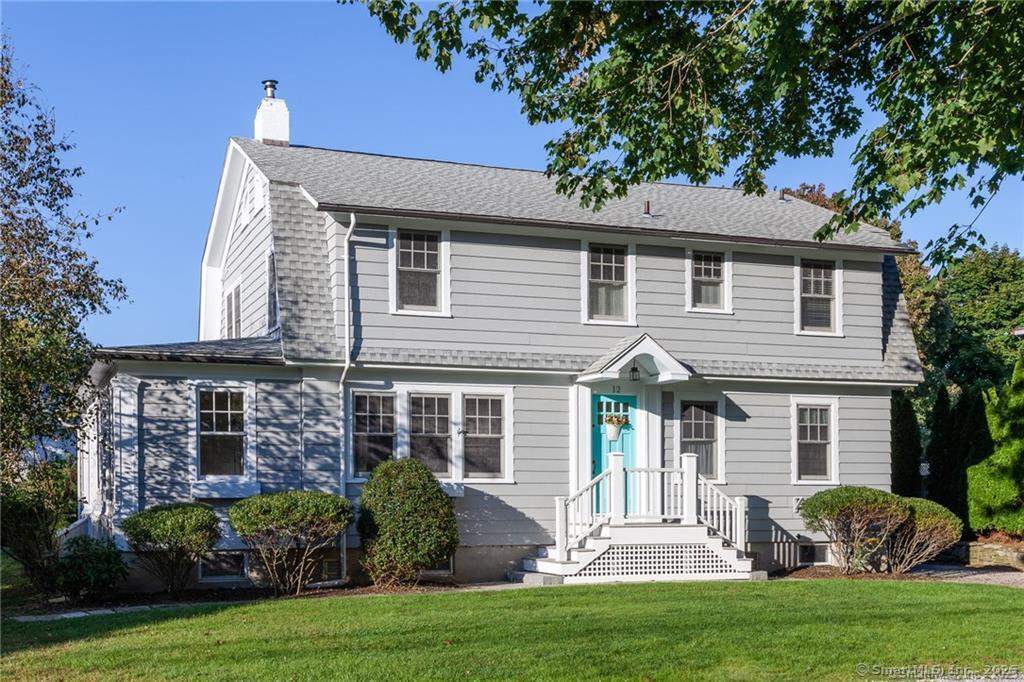 12 Flower Avenue Madison, CT 06443 - Photo 20 of 24 front view of a house with a yard