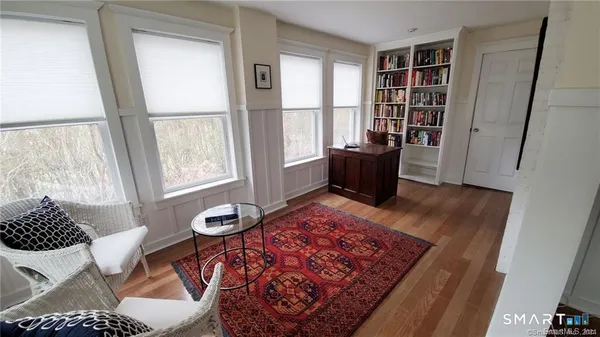 a living room with a couch and a window