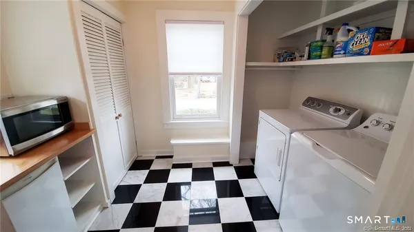 a room with a black white checkered floor and a black white checkered floor with a black white checkered floor