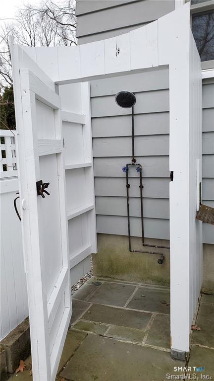 12 Flower Avenue Madison, CT 06443 - Photo 7 of 24 a view of a room with shelves