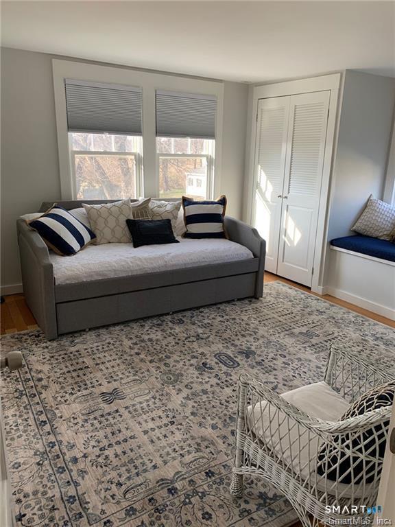 12 Flower Avenue Madison, CT 06443 - Photo 9 of 24 a living room with furniture window and a potted plant