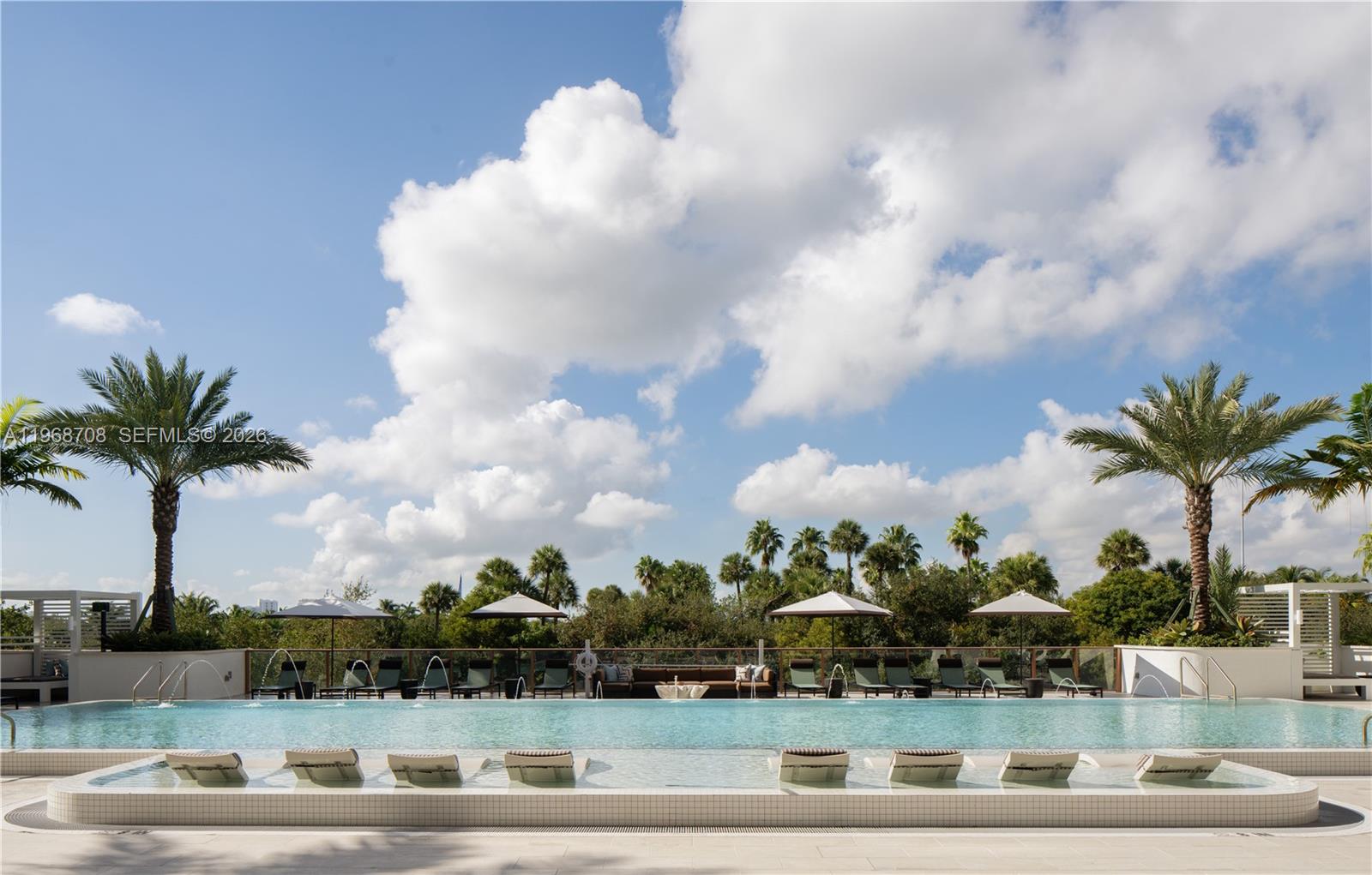 3900 Alton Road, Unit 719 Miami Beach, FL 33140 - Photo 12 of 16 a view of white house with outdoor space