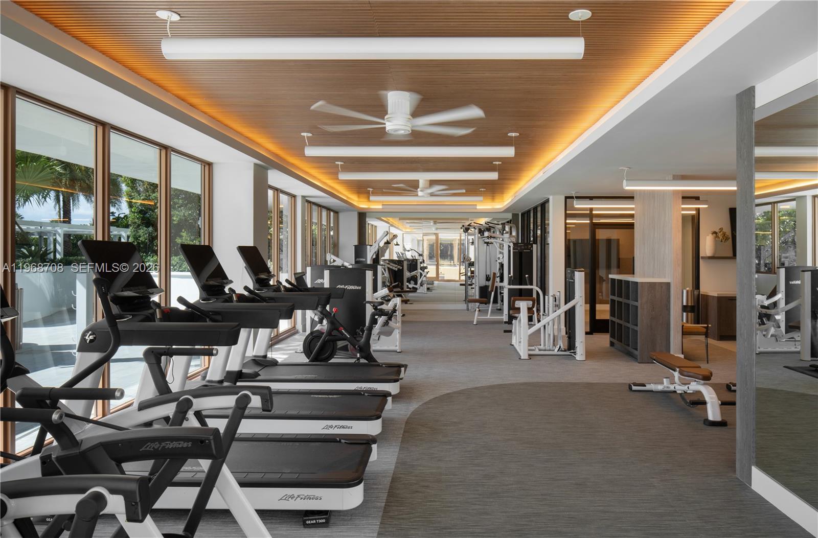 3900 Alton Road, Unit 719 Miami Beach, FL 33140 - Photo 14 of 16 a view of a room with gym equipment