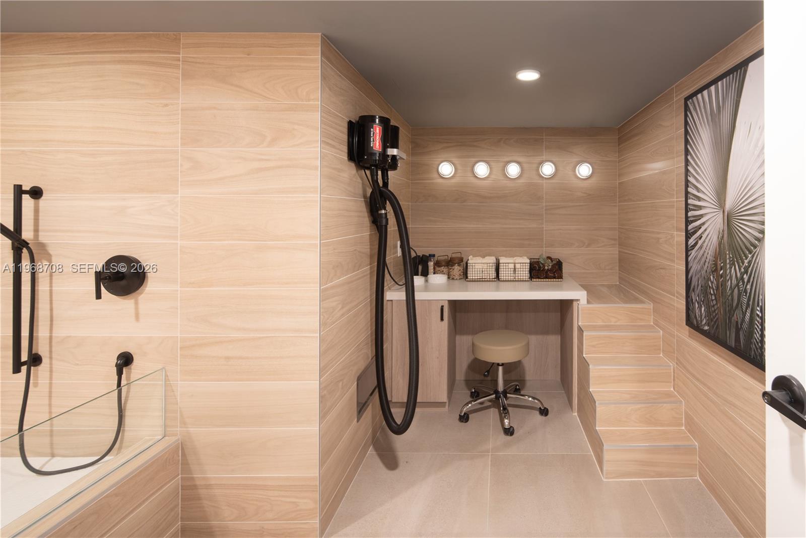 3900 Alton Road, Unit 719 Miami Beach, FL 33140 - Photo 15 of 16 a bathroom with a sink and mirror