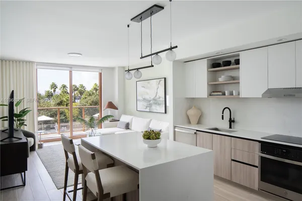 a view of a kitchen area with furniture and a window