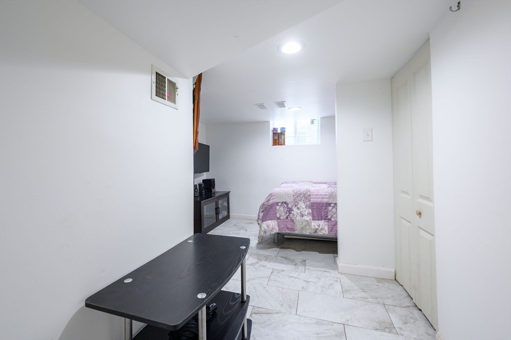 44 Patterson Street Weymouth, MA 02189 - Photo 19 of 27 a view of a room with furniture and window