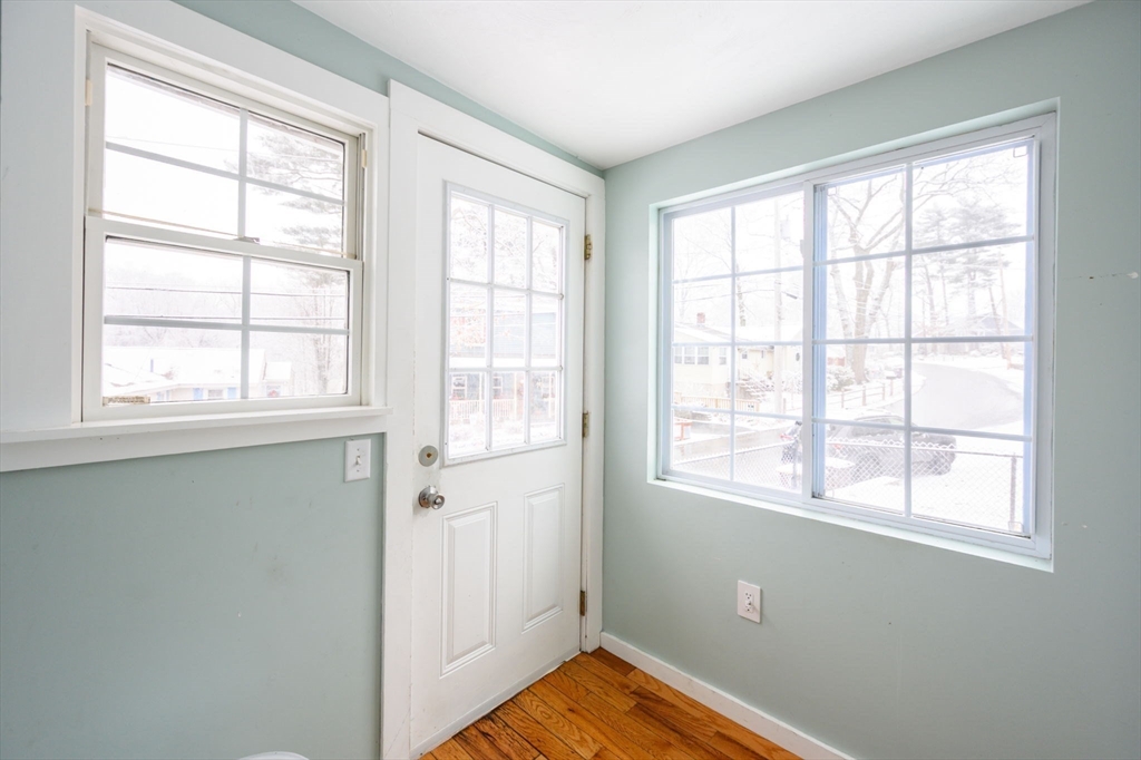 44 Patterson Street Weymouth, MA 02189 - Photo 4 of 27 a view of an empty room with wooden floor and a window
