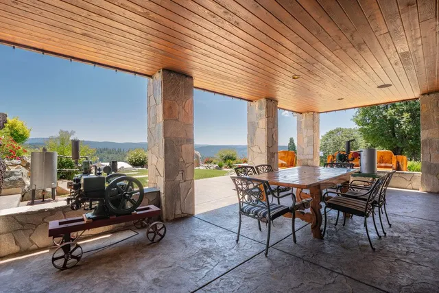 a house view with a sitting space and garden
