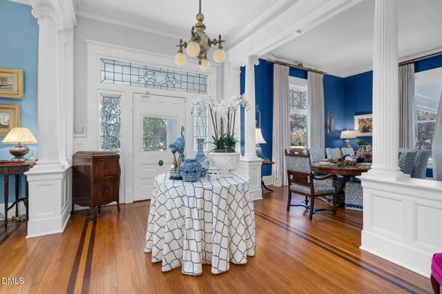 a view of a dining room with furniture and wooden floor