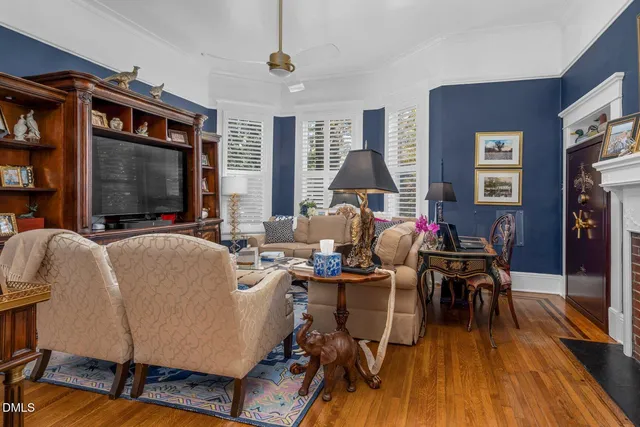 a bathroom with a granite countertop toilet a sink and a mirror
