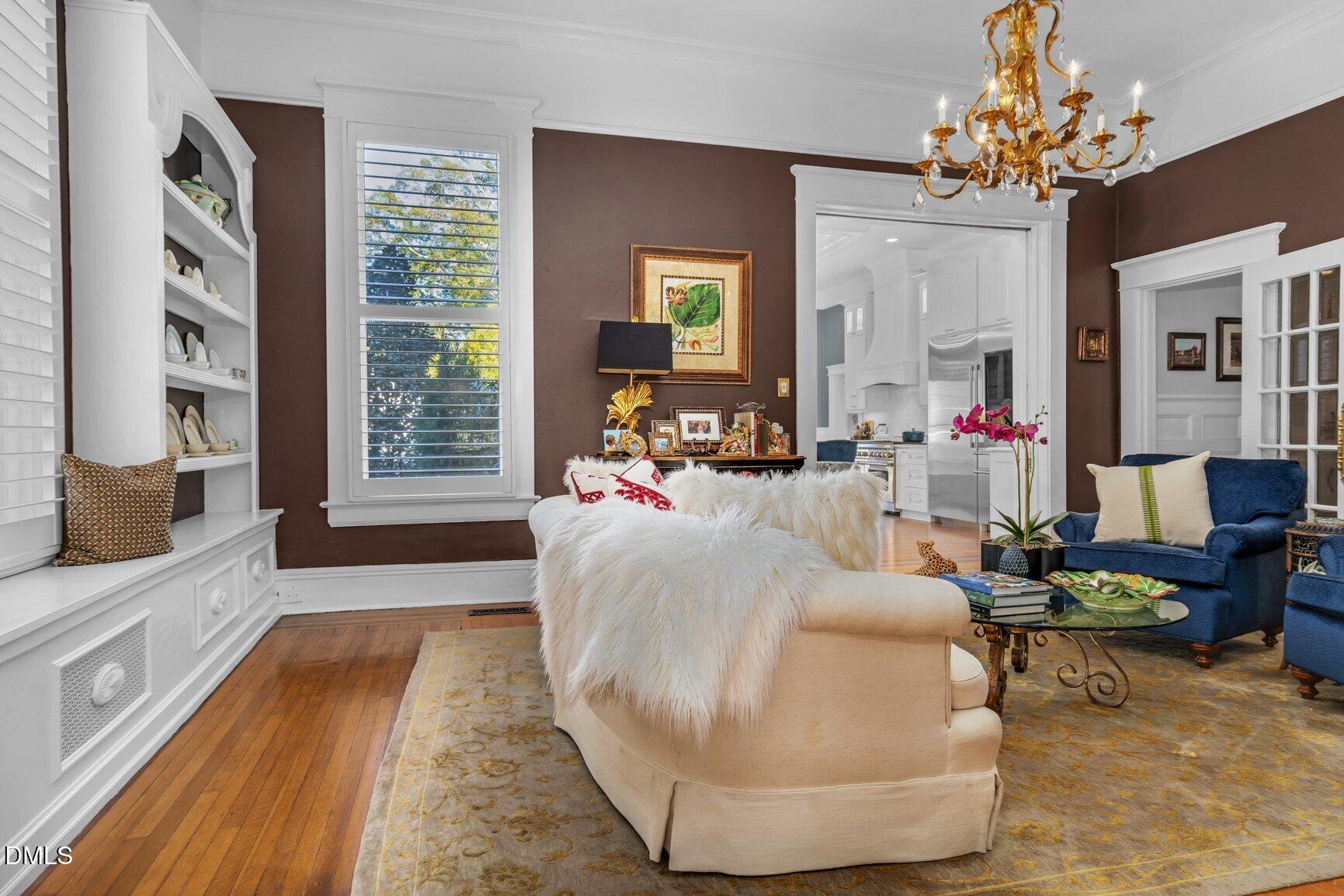 1109 North Main Street Tarboro, NC 27886 - Photo 33 of 90 a living room with furniture and a chandelier