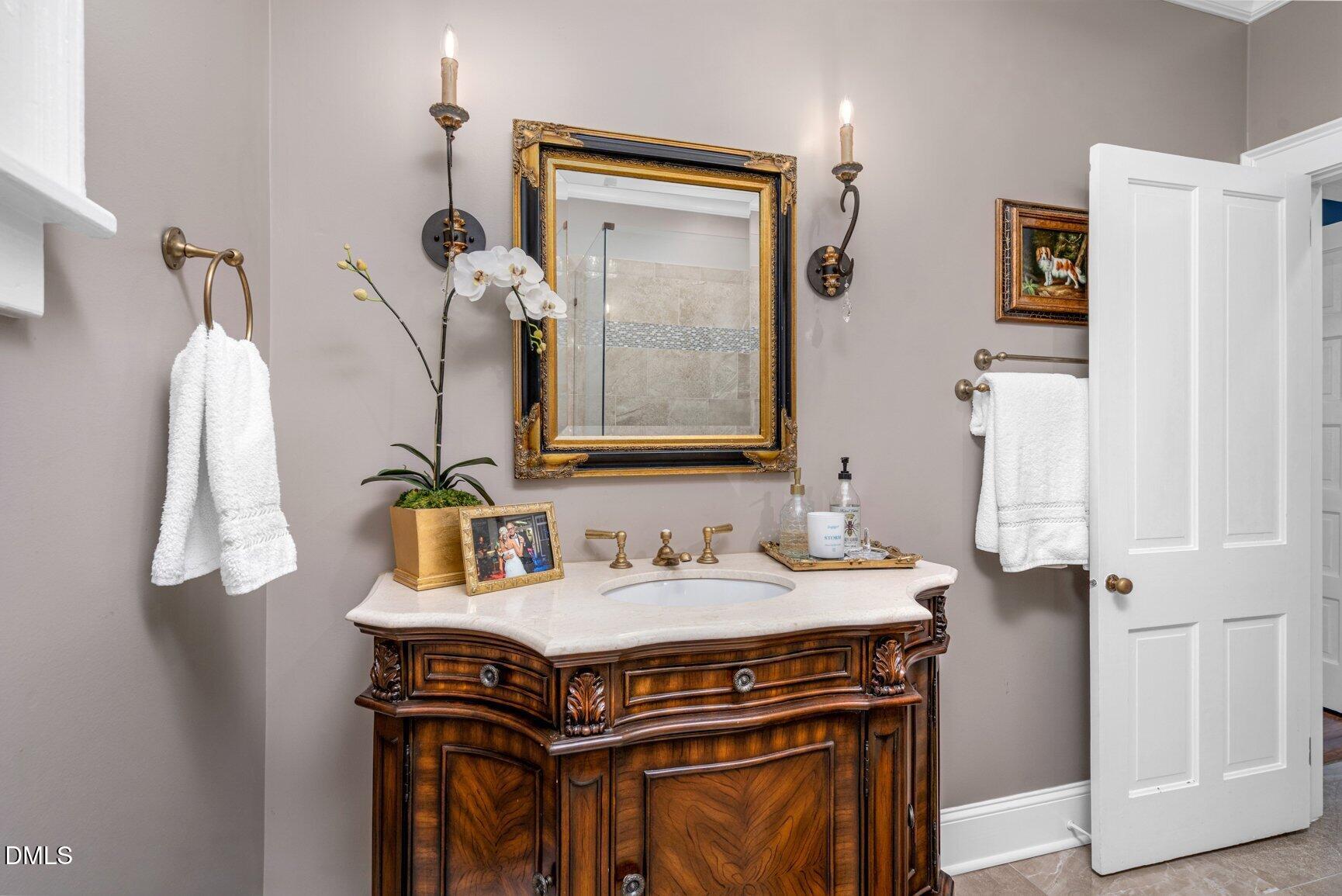 1109 North Main Street Tarboro, NC 27886 - Photo 40 of 90 a bathroom with a sink and a mirror
