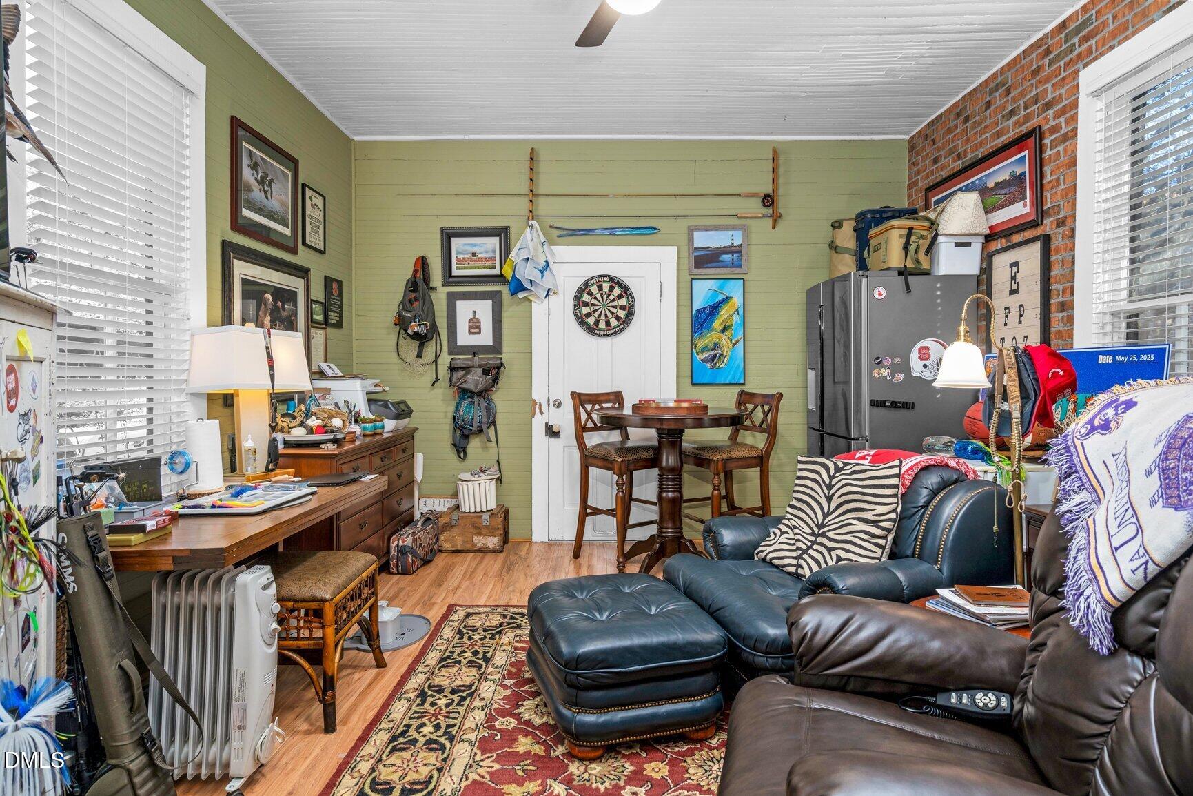 1109 North Main Street Tarboro, NC 27886 - Photo 43 of 90 a living room with furniture and a clock