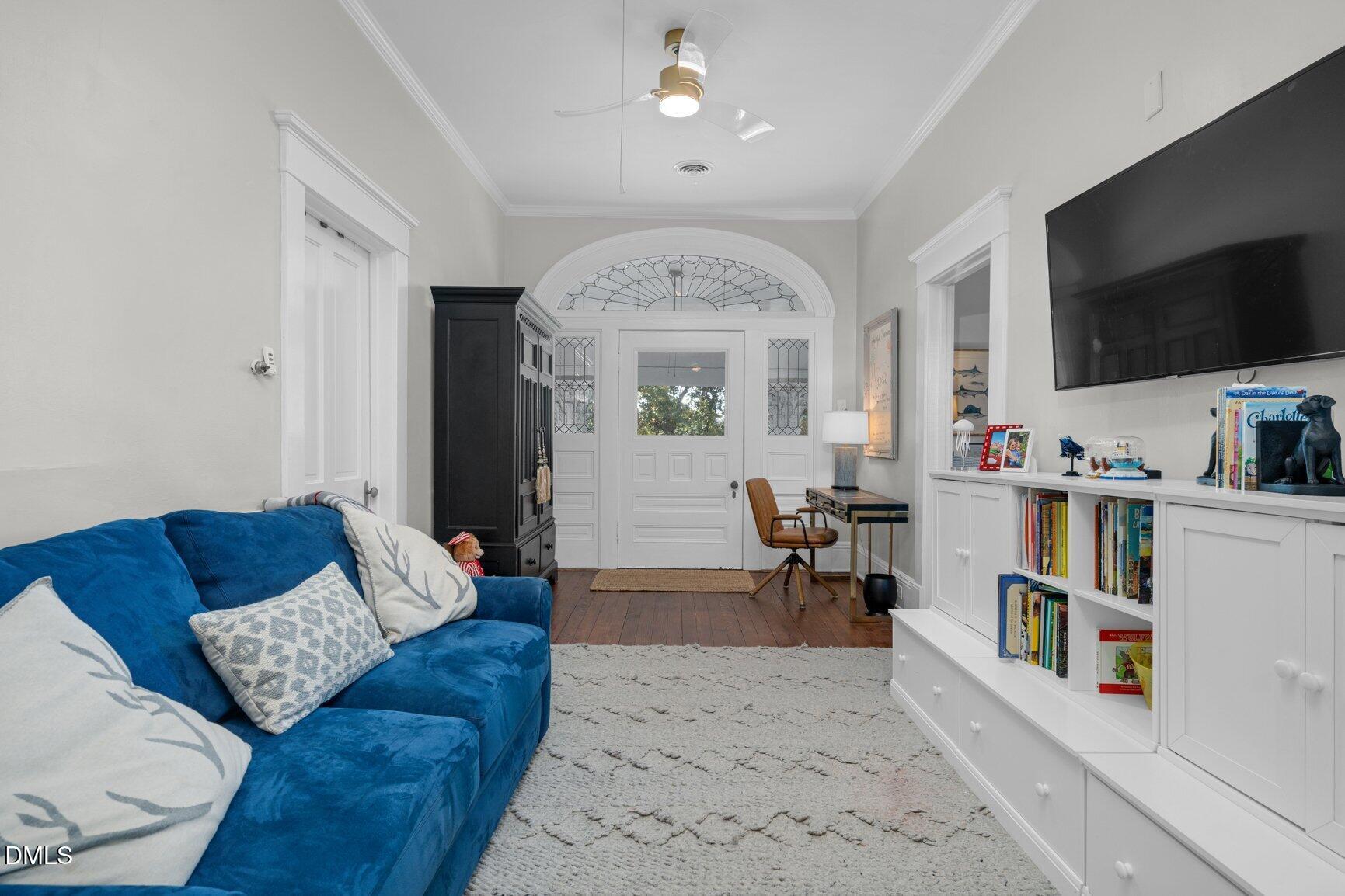 1109 North Main Street Tarboro, NC 27886 - Photo 47 of 90 a living room with furniture and a flat screen tv