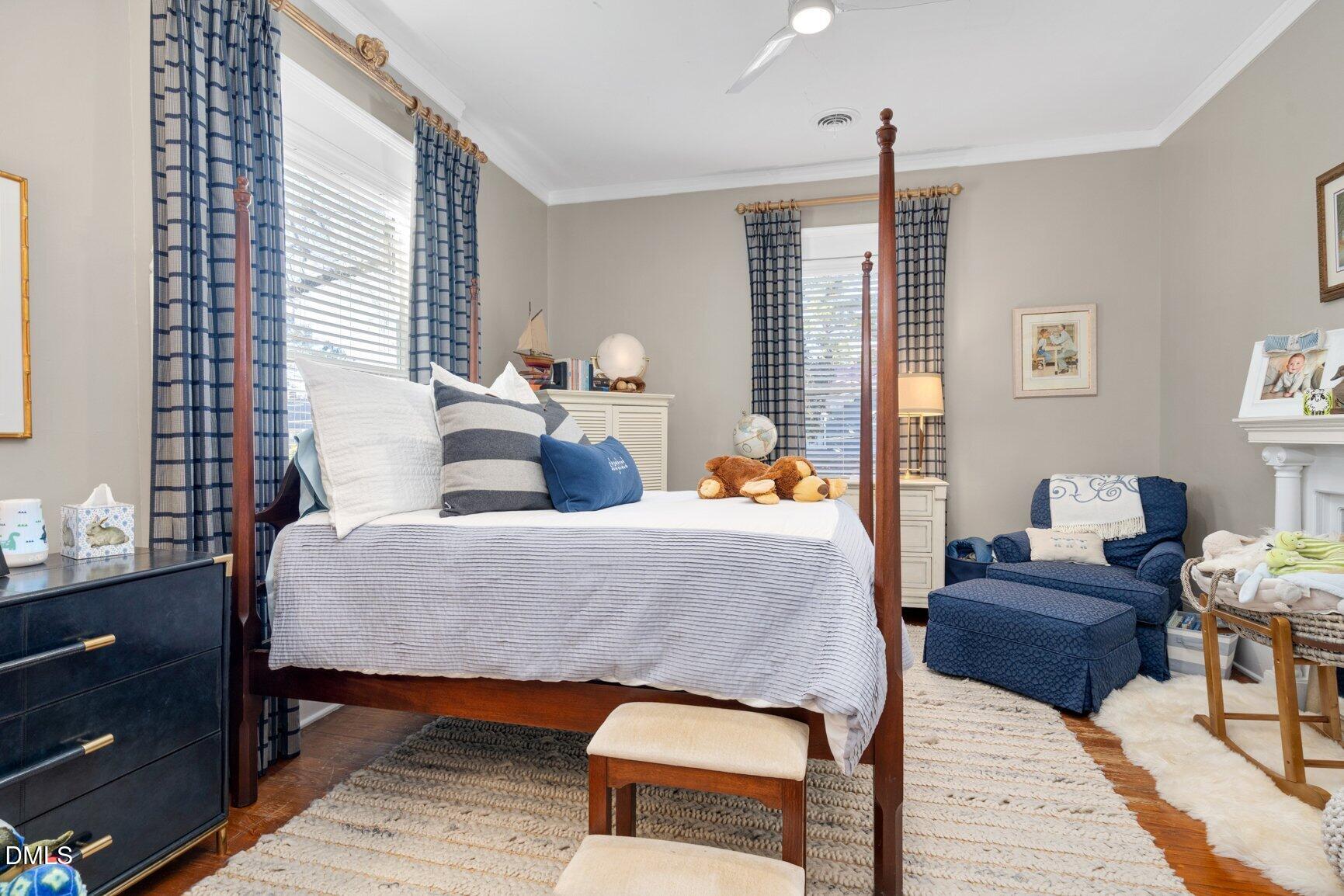 1109 North Main Street Tarboro, NC 27886 - Photo 51 of 90 a bedroom with a bed and wooden floor