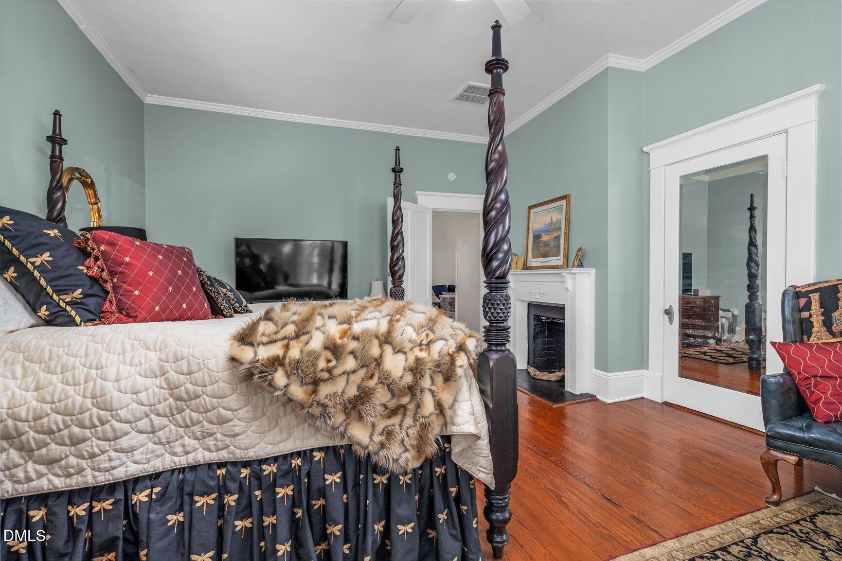 1109 North Main Street Tarboro, NC 27886 - Photo 59 of 90 a bed room with furniture and a fireplace