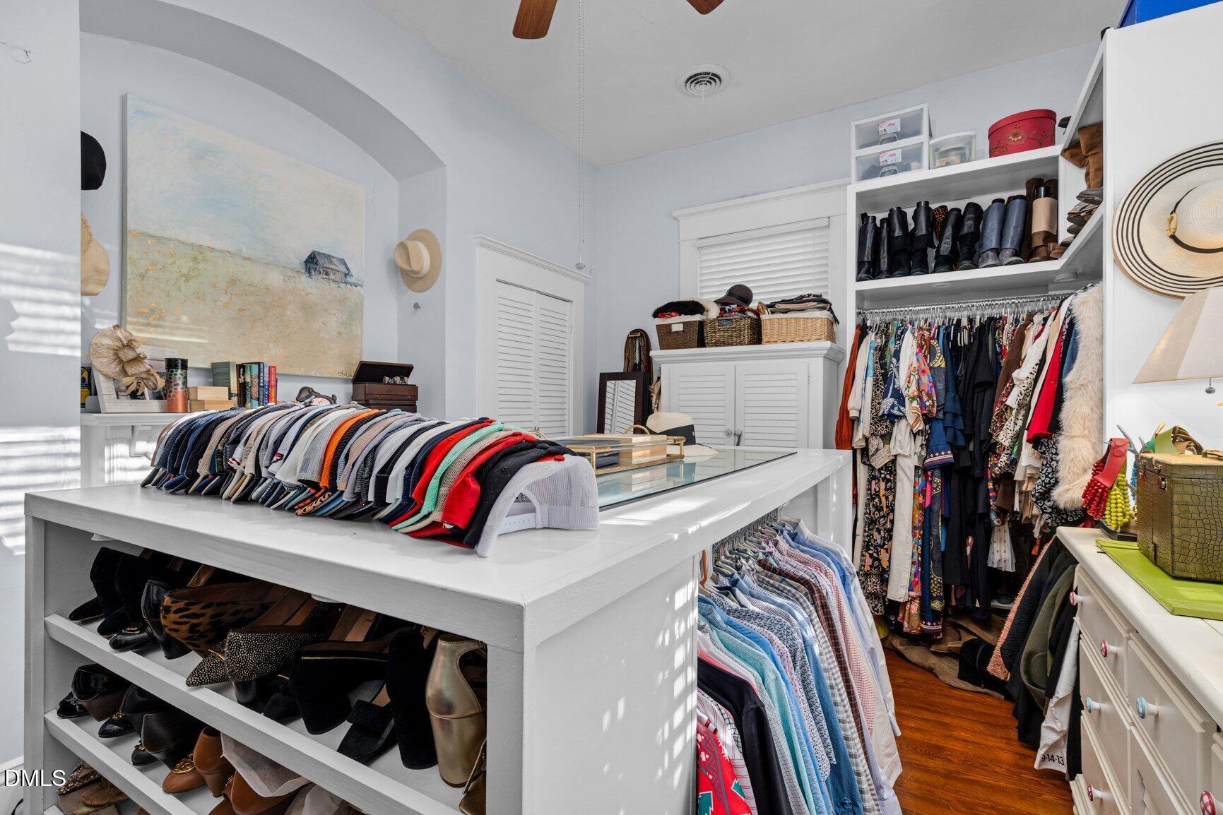 1109 North Main Street Tarboro, NC 27886 - Photo 66 of 90 a view of walk in closet with clothes and shoes