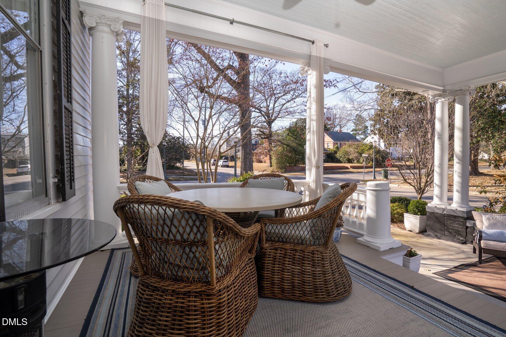 1109 North Main Street Tarboro, NC 27886 - Photo 70 of 90 a dining room with furniture large windows and wooden floor