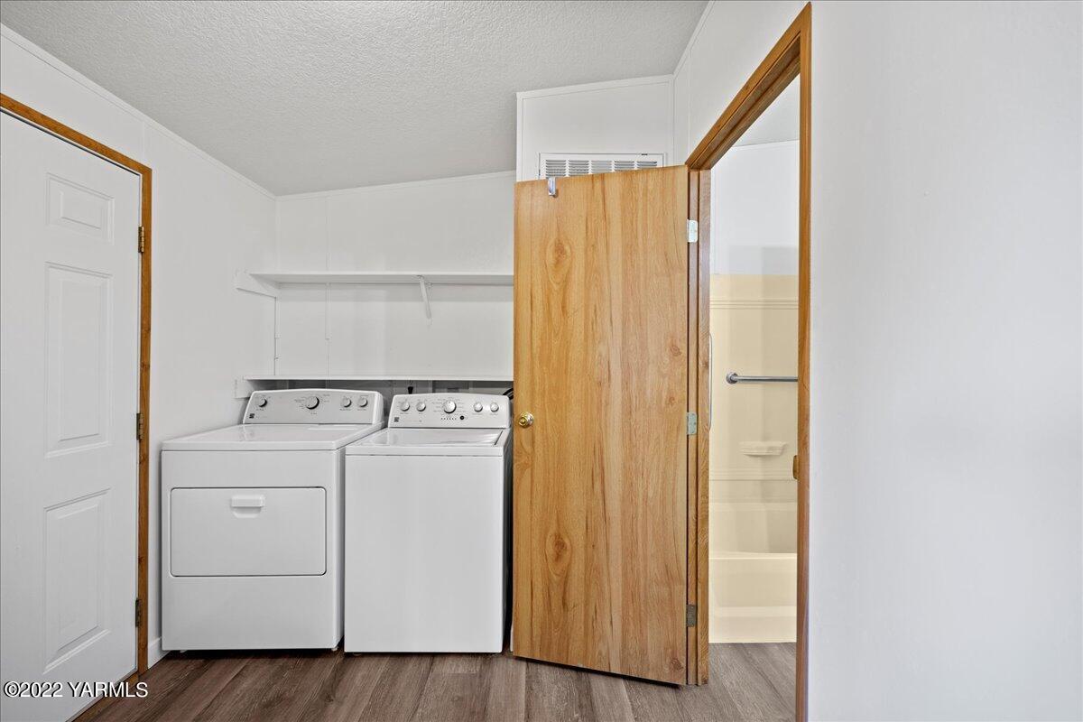 1200 South Euclid Road, Unit 84 Grandview, WA 98930 - Photo 15 of 24 a view of storage and utility room with washer and dryer