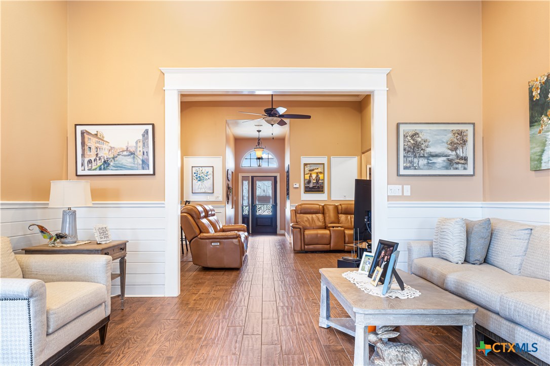 790 Spanish Grant Road Goliad, TX 77963 - Photo 10 of 41 a living room with furniture and a wooden floor