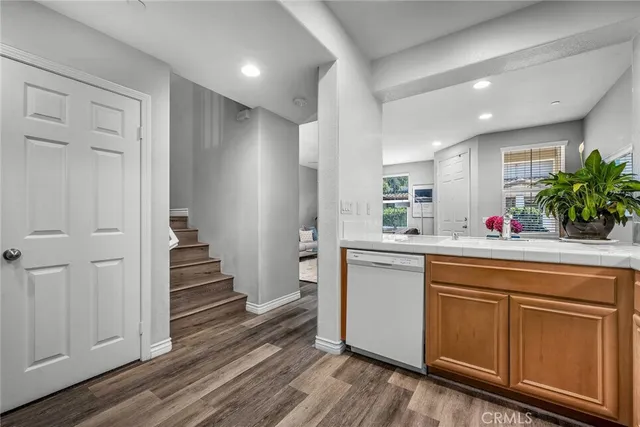 a kitchen with sink and cabinets