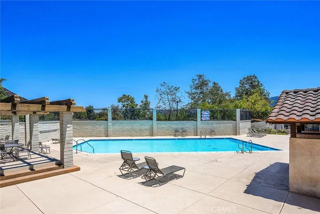 a view of a swimming pool with a lounge chairs