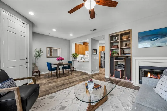 a living room with furniture dining table and a fireplace