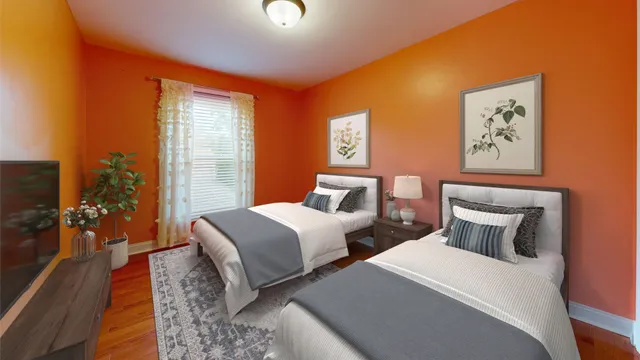 a bedroom with a large bed and a chandelier