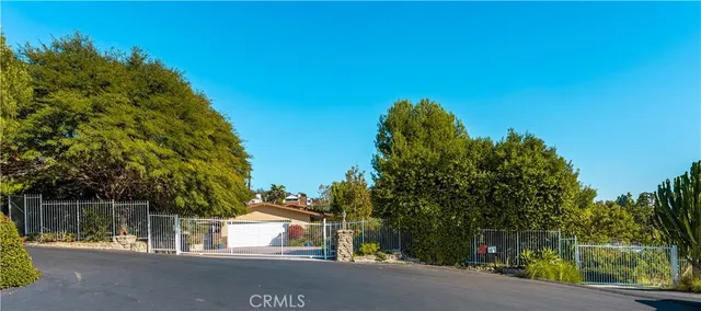 a view of a street with a building in the background