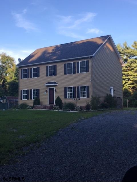 120 Leeds Point Road Galloway Township, NJ 08205 - Photo 1 of 1 a view of a yard in front of a house with plants and large trees