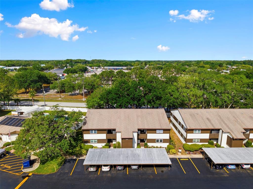 4101 Passport Lane, Unit 203 New Port Richey, FL 34653 - Photo 2 of 83 an aerial view of a house with a garden
