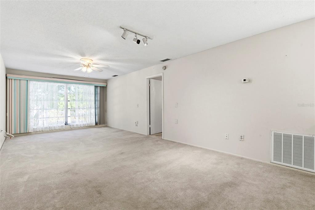 4101 Passport Lane, Unit 203 New Port Richey, FL 34653 - Photo 22 of 83 a view of an empty room with a window