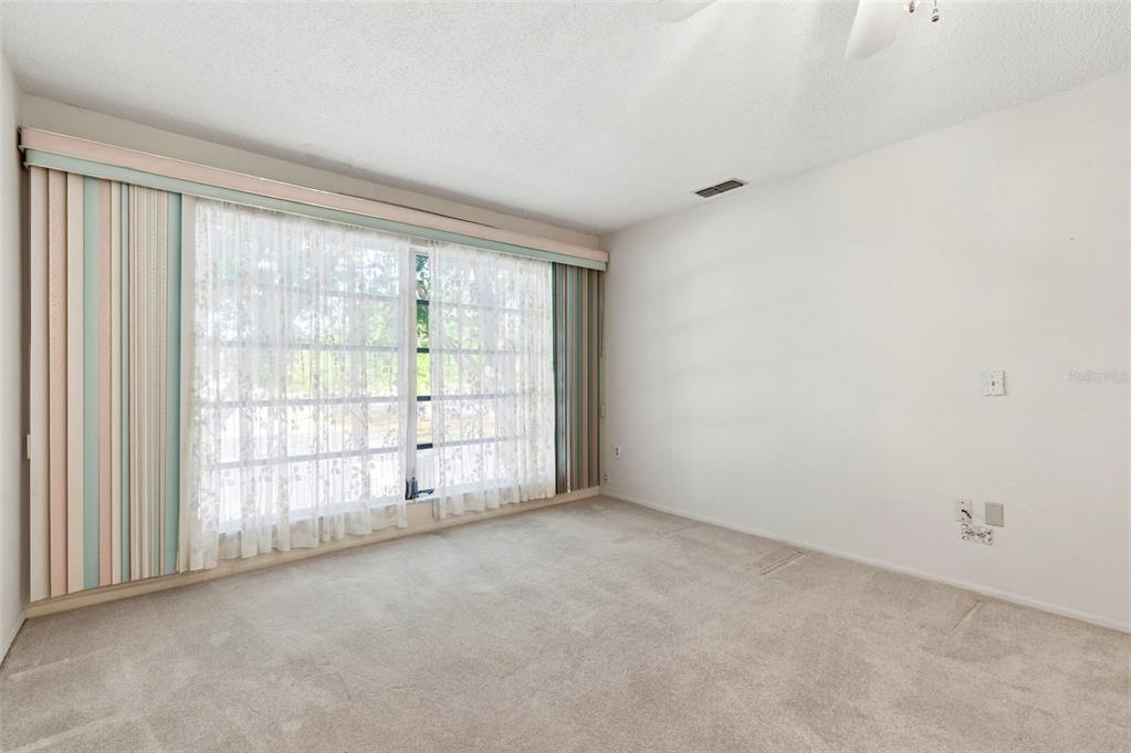 4101 Passport Lane, Unit 203 New Port Richey, FL 34653 - Photo 24 of 83 a view of an empty room with a window