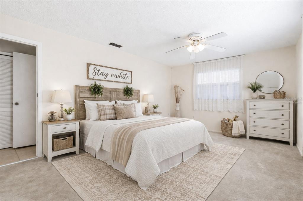 4101 Passport Lane, Unit 203 New Port Richey, FL 34653 - Photo 34 of 83 a bedroom with a bed and a dresser