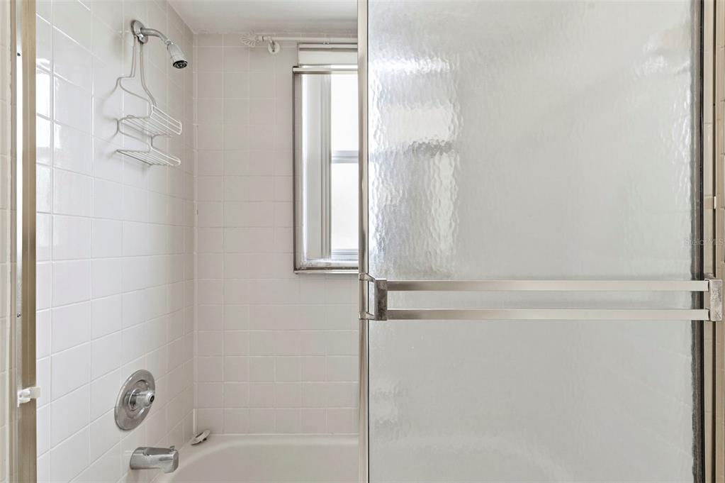 4101 Passport Lane, Unit 203 New Port Richey, FL 34653 - Photo 41 of 83 a bathroom with a shower