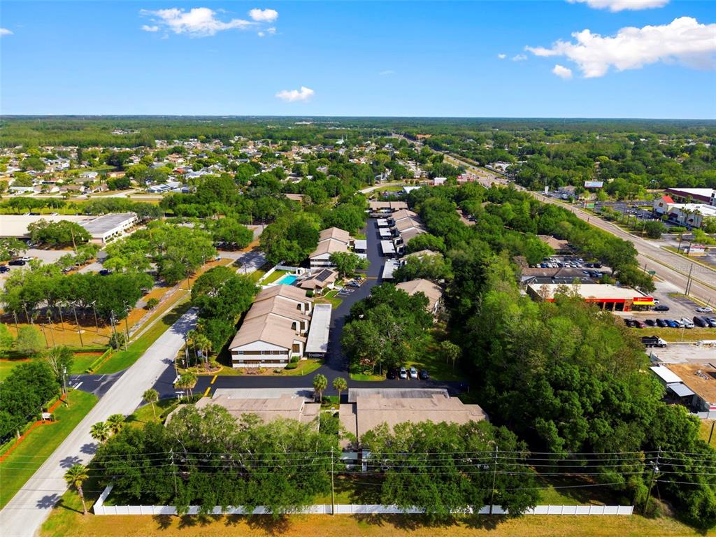 4101 Passport Lane, Unit 203 New Port Richey, FL 34653 - Photo 54 of 83 an aerial view of residential houses with outdoor space and street view