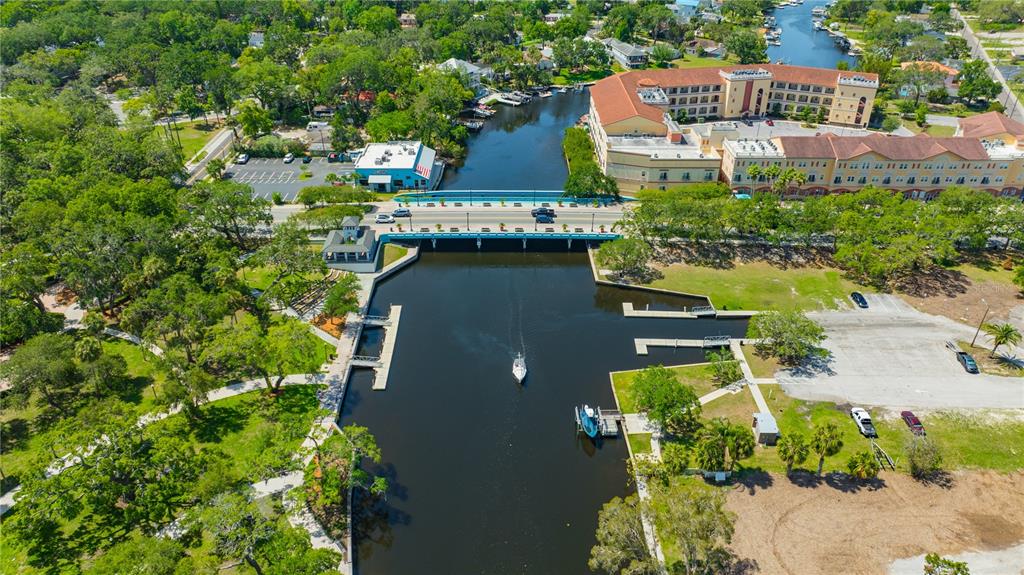 4101 Passport Lane, Unit 203 New Port Richey, FL 34653 - Photo 61 of 83 an aerial view of a house with a yard and lake view