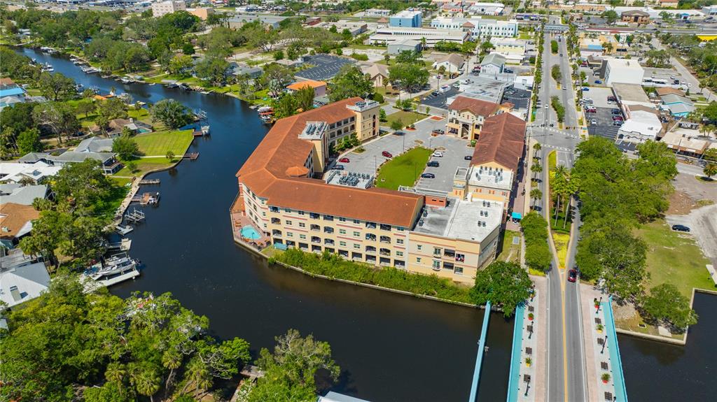 4101 Passport Lane, Unit 203 New Port Richey, FL 34653 - Photo 62 of 83 an aerial view of a house a yard and a garden