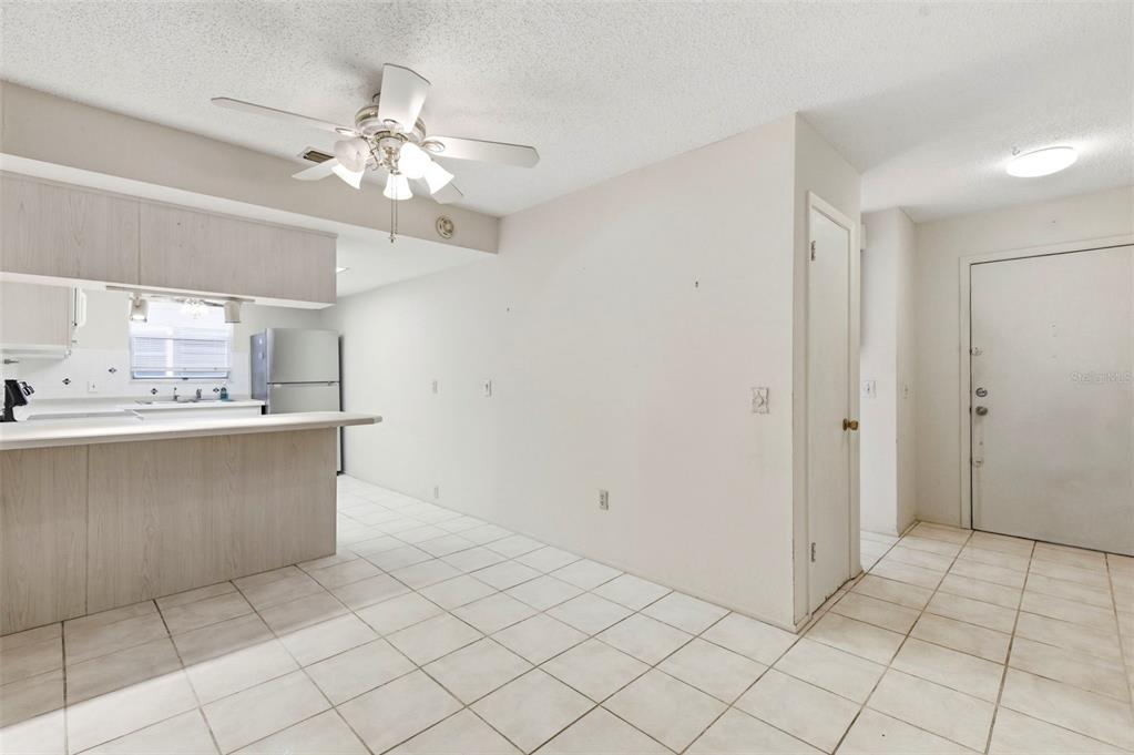 4101 Passport Lane, Unit 203 New Port Richey, FL 34653 - Photo 7 of 83 a view of kitchen with granite countertop cabinets and window