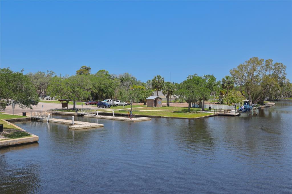 4101 Passport Lane, Unit 203 New Port Richey, FL 34653 - Photo 71 of 83 a view of a swimming pool with lounge chair